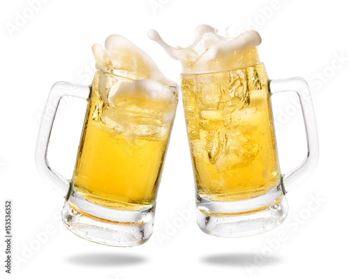 Slika na platnu Cheers cold beer with splashing out of glasses on white background