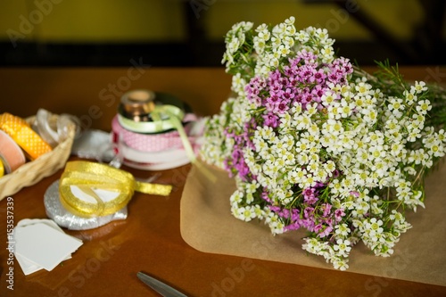 Fototapeta Naklejka Na Ścianę i Meble -  Flowers on the wooden worktop at flower shop