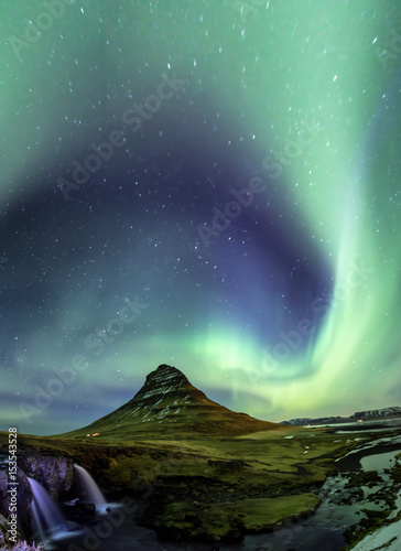 Northern Light Aurora borealis at Kirkjufell Iceland with fully start in the sky photo