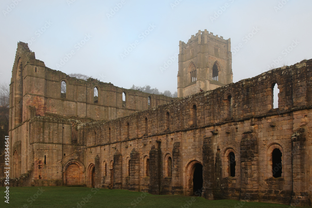 Twelfth Century Fountains Abbey North Yorkshire on a misty day