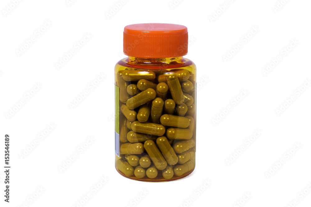 Herbal capsules in the bottle isolated on white background Herbal capsules in the bottle isolated on white background