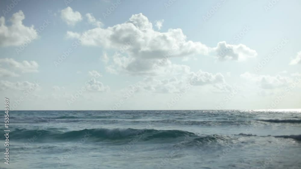 Beautiful ocean with nice clouds above on sunny day.
Beautiful ocean with nice clouds above on sunny day.