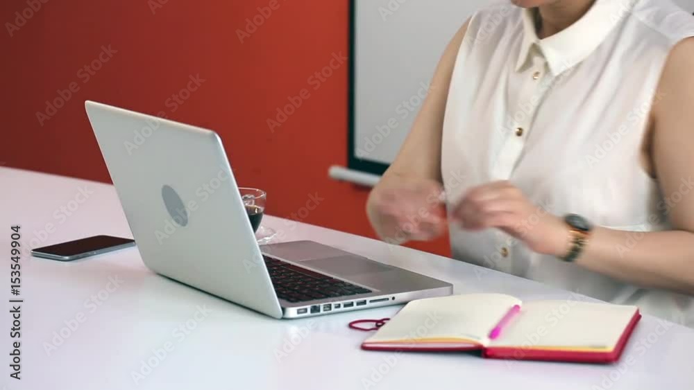 Beautiful young Caucasian businesswoman working with tablet computer and documents in office. City lifestyle portrait of female manager. Close-Up Woman portrait using communication technologies. Beautiful young Caucasian businesswoman working with tablet computer and documents in office. City lifestyle portrait of female manager. Close-Up Woman portrait using communication technologies.