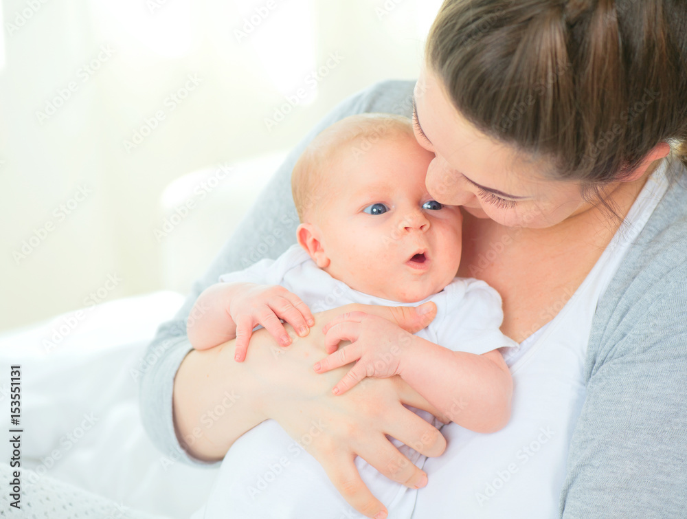Happy mother and her newborn baby. Maternity concept