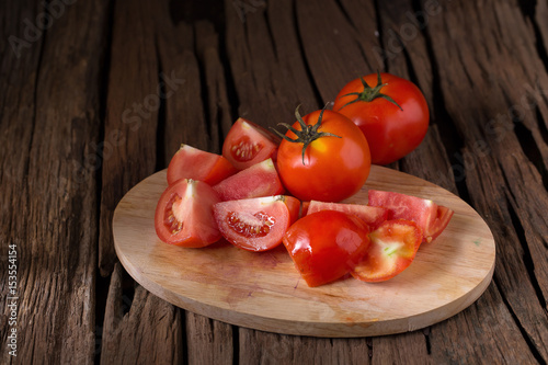 Tomato on a wooden background
