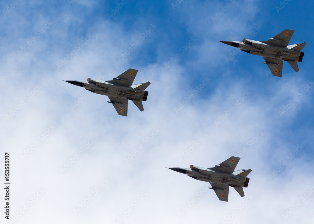 War planes in blue sky with clouds at the victory parade in the capital of Kazakhstan Astana in 2017 War planes in blue sky with clouds at the victory parade in the capital of Kazakhstan Astana in 2017