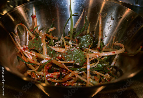 korean side dish of pickled onion and sesame leaves