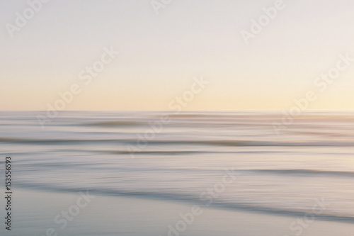 Scenic view of seascape against clear sky during sunset