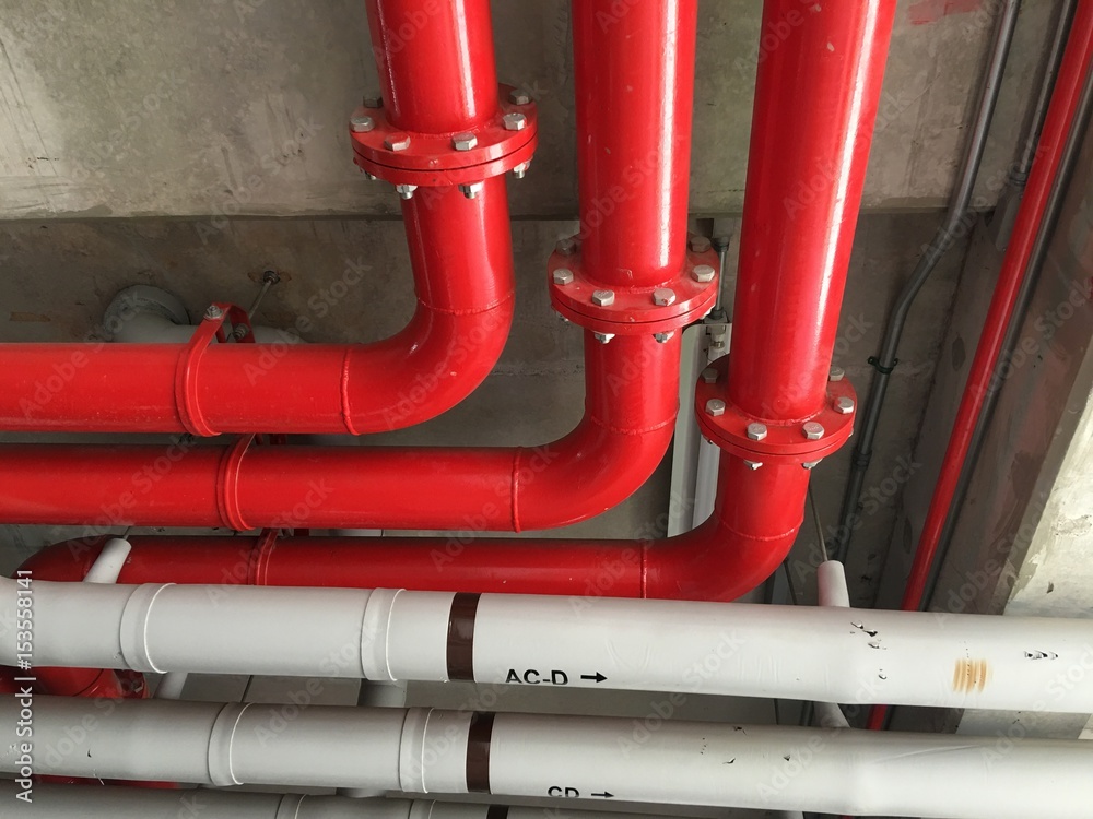 Bare skin ceiling show red pipeline on concrete ceiling. Bare skin ceiling show red pipeline on concrete ceiling.