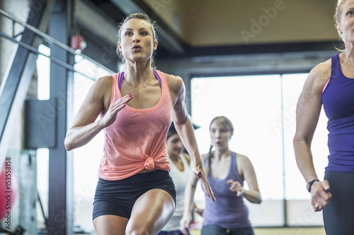 Women exercising in gym photo