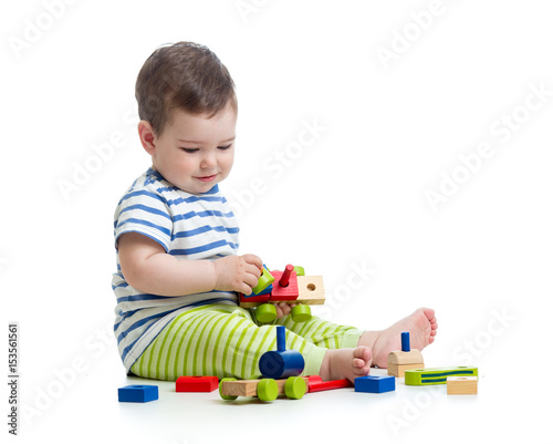 Baby boy playing with block...