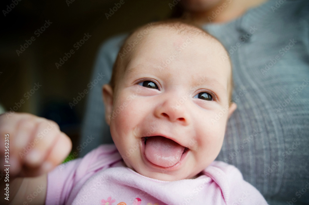 Midsection of mother with happy daughter at home Midsection of mother with happy daughter at home