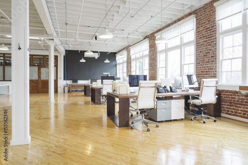 Interior of office with furniture and desktop computers