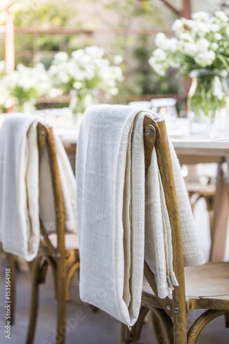 Close-up of fabric on chairs by dinning table photo