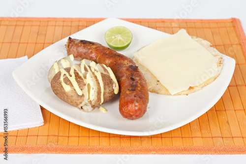 Grilled Sausage with arepa and cooked potato