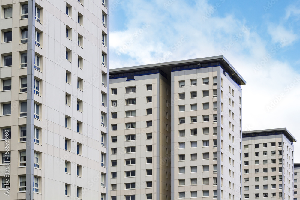 White, modern blocks of flats and blue sky, modern background