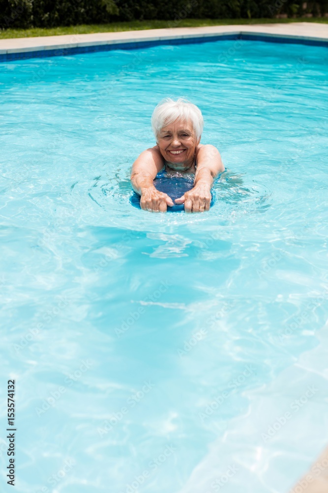 Senior woman swimming in the pool