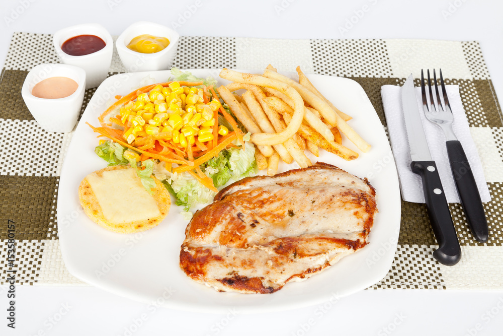 Grilled chicken with french fries and salad Grilled chicken with french fries and salad