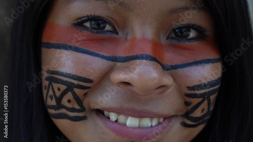 Closeup face of Native Brazilian Woman at an indigenous tribe in the Amazon photo