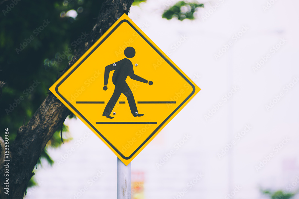 beware people single man cross the road traffic sign yellow color on the street with space for text. beware people single man cross the road traffic sign yellow color on the street with space for text.