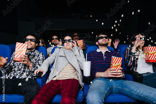 People watching a thrilling 3D horror movie