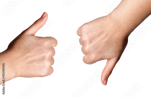Woman hand with thumb up and thumb down isolated on white background.