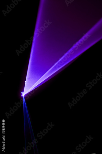 Laser beam purple on a black background