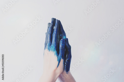 Painted blue hands