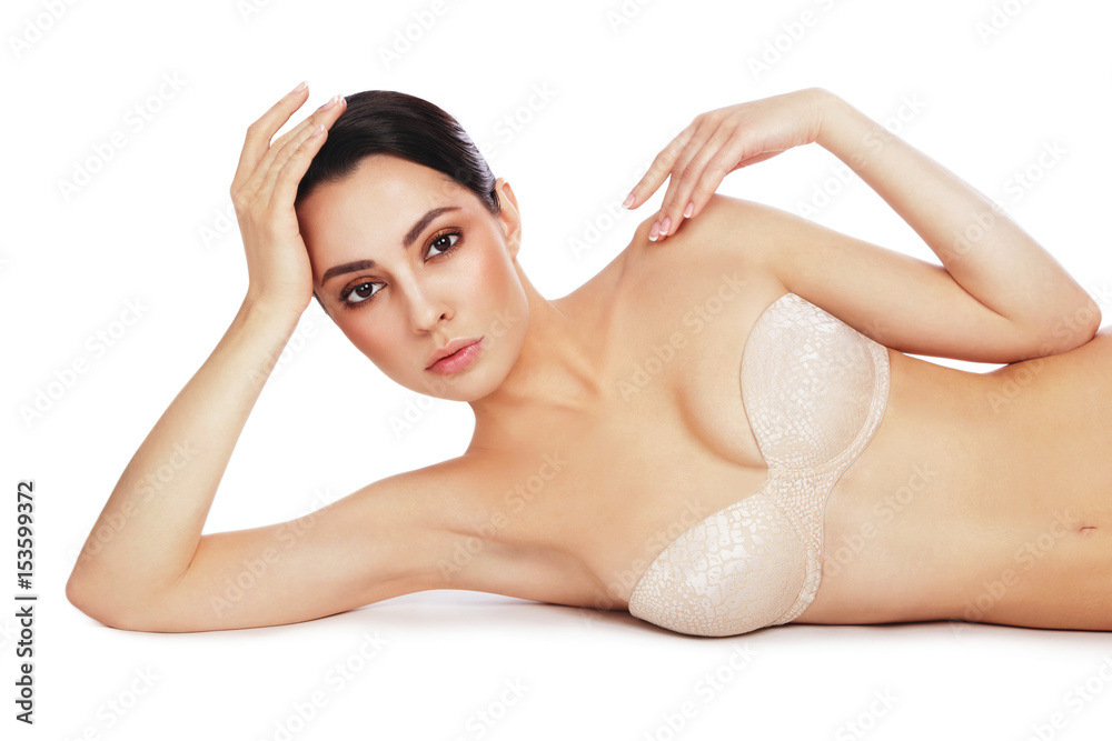 Young slim beautiful sexy woman in bra over white background, copy space Young slim beautiful sexy woman in bra over white background, copy space