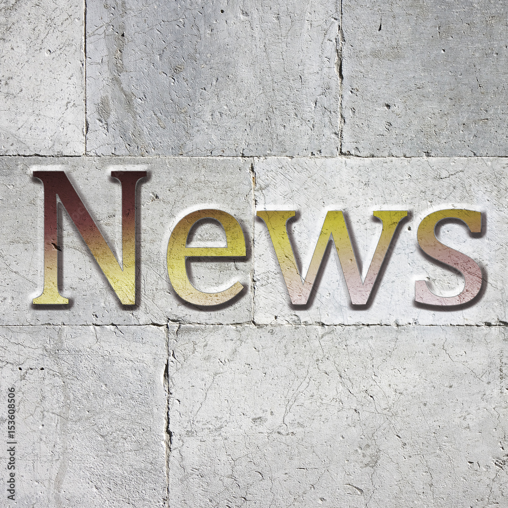 News carved on white stone wall News carved on white stone wall
