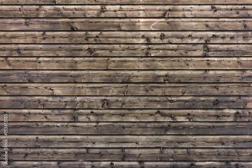 Dark wooden texture. Wood brown texture. Background old panels. Rustic background. Vintage colored surface.