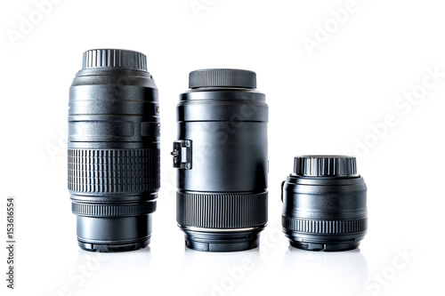 Lenses to a SLR camera close-up with reflection isolated on a white background
