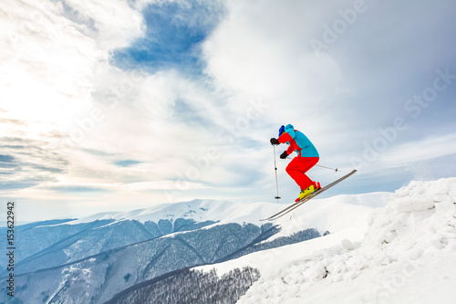 Good skiing in the snowy mountains, Carpathians, Ukraine. Good winter day, incredible ski jump, ski season.