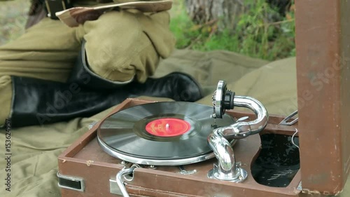 The army of the USSR. Soviet army soldiers are resting. Soldiers listen to a gramophone. Soviet Union soldiers in camp. Reconstruction of the Soviet army.