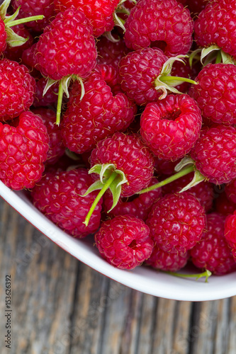 raspberry on wooden surface