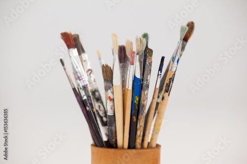 Varieties of paint brushes in jar