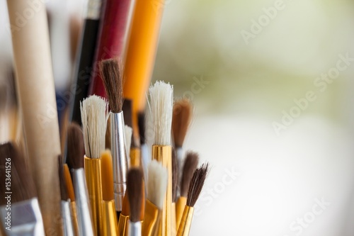 Set of paint brushes in a jar