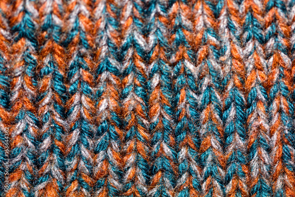 Closeup of colored knitted wool, background
