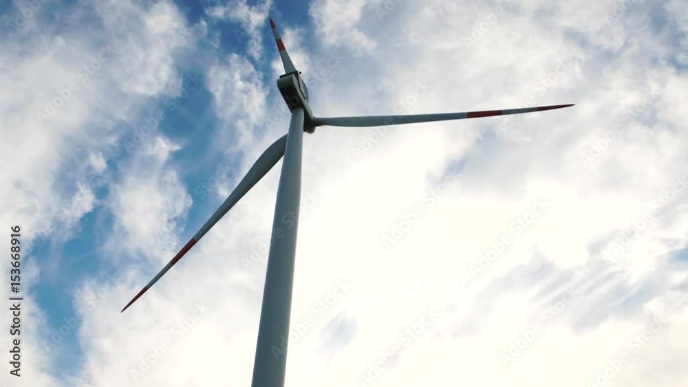 Wind turbines moving and a blue skye with clouds, 4K Wind turbines moving and a blue skye with clouds, 4K