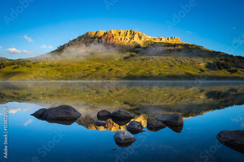 Sunrise on lake with Bear to Butte in the background, Montana