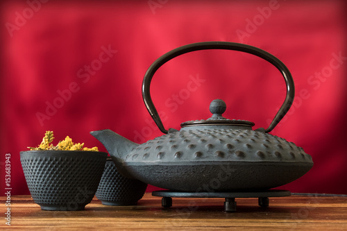 Cast iron Asian teapot with herbal tea 