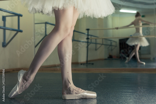 Long legs of ballerina in toeshoe photo