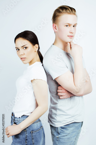 best friends teenage asian girl and boy together having fun, posing emotional on white background, couple happy smiling, lifestyle people concept, blond and brunette multi nations 