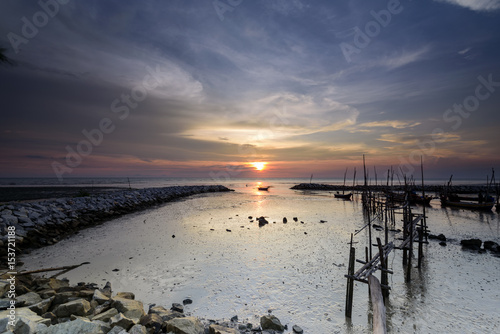 background beautiful sky during sunset and jetty fisherman boats