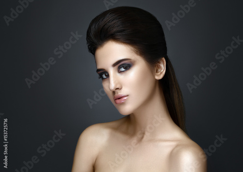 Beautiful woman with evening make-up and updo