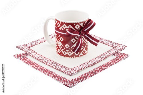 Mug and tablecloth with national latvian ornament
