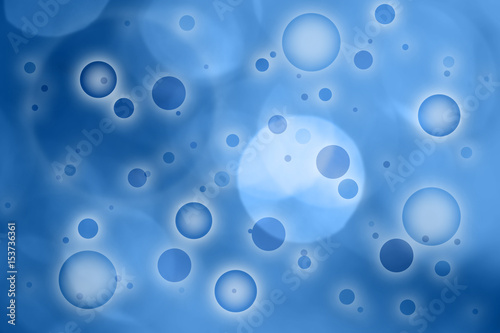 Beautiful blurred abstract circle pattern on the blue colored background.