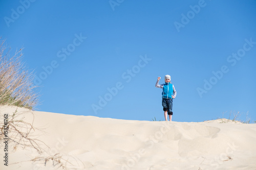 Wallpaper Mural kid playing with sand in the beach Torontodigital.ca