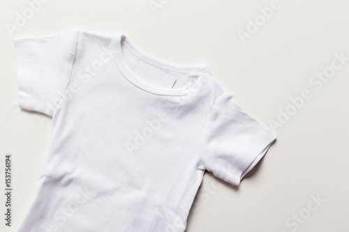 clothes for newborn on table
