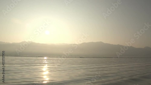 Nyaung Shwe, POV from boat on floating mountains at sunrice photo